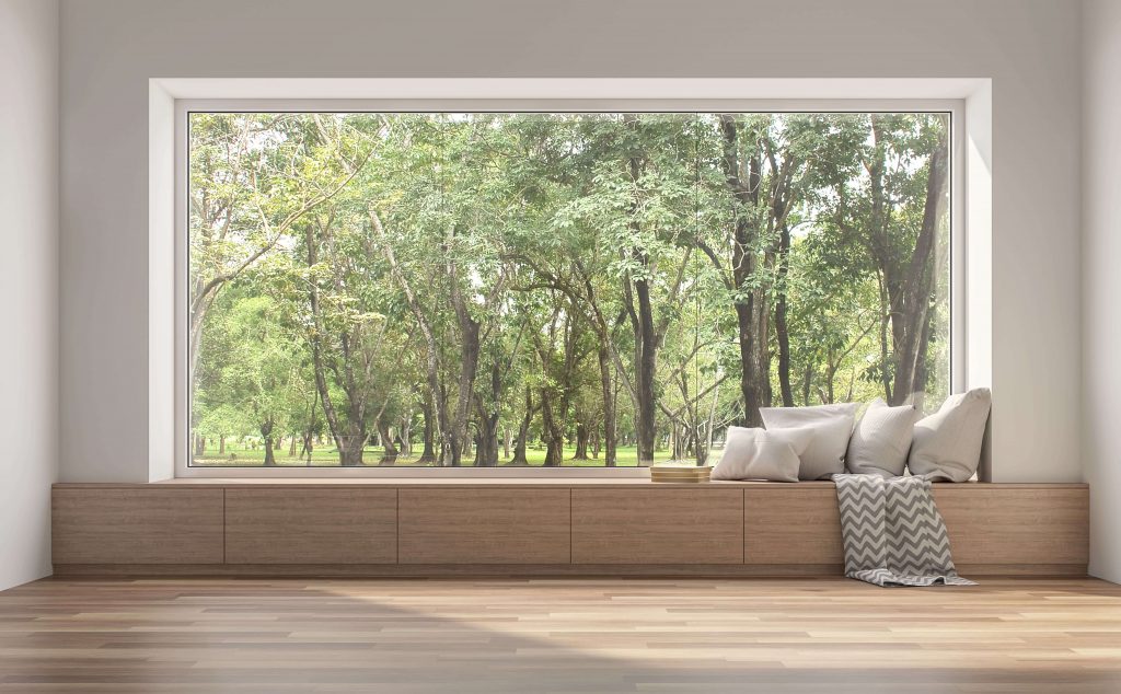 Large picture window with forest view
