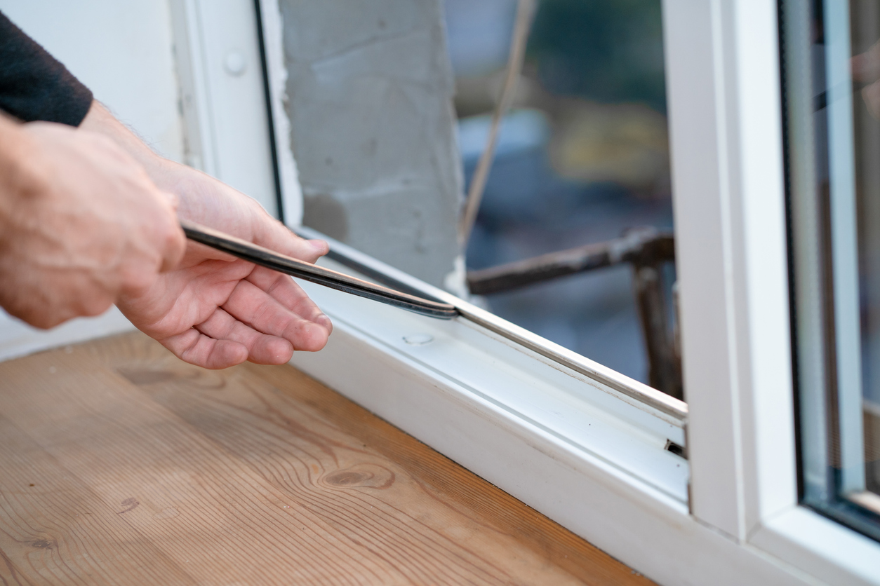 Professional master at repair and installation of windows, changes rubber seal gasket in pvc windows.